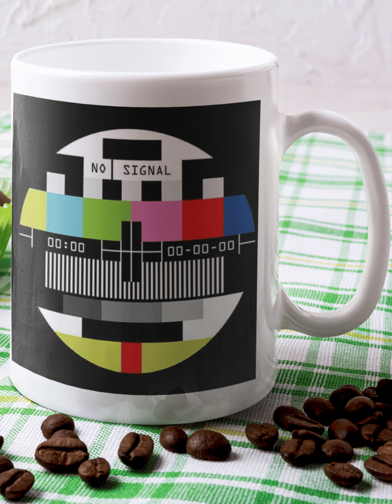 Retro coffee mug featuring multicolor TV test pattern and “No Signal” text, 11 oz ceramic vintage-style mug