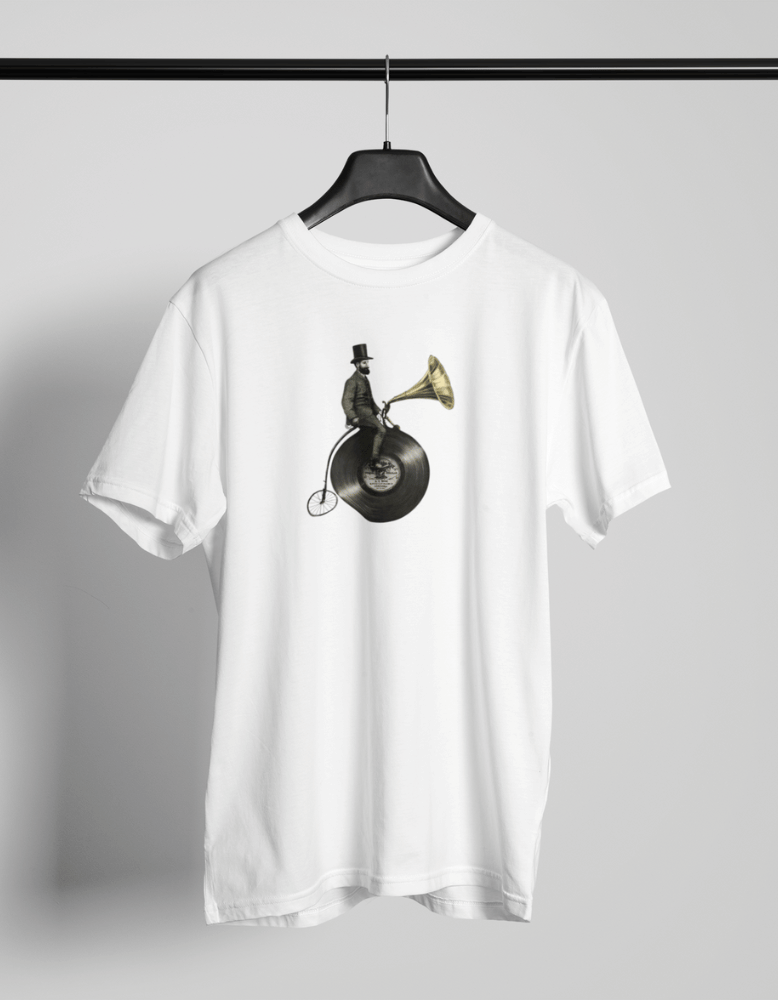 White t-shirt with a surreal vintage design of a man riding a bicycle with a vinyl record wheel and a gramophone speaker